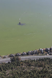 Aerial view of houses by polluted dian lake