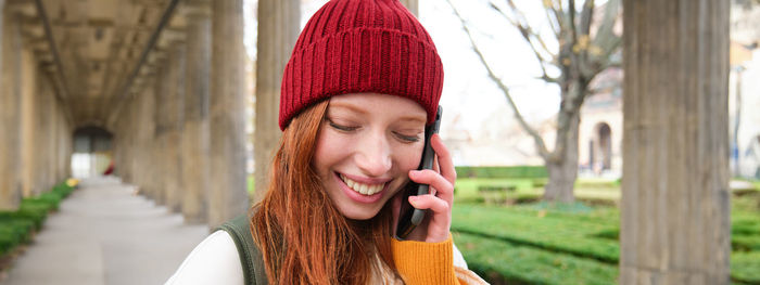 Portrait of young woman wearing hat