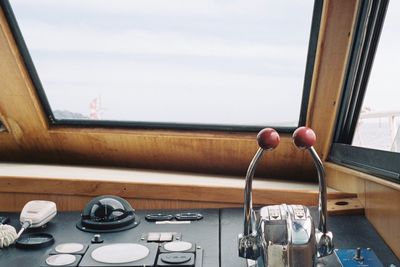 Electric lamp on table by sea