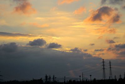 Silhouette trees against sky during sunset