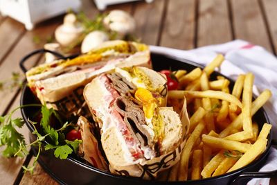 Close-up of fast food served in plate on table