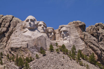 Low angle view of mt rushmore national monument against clear sky