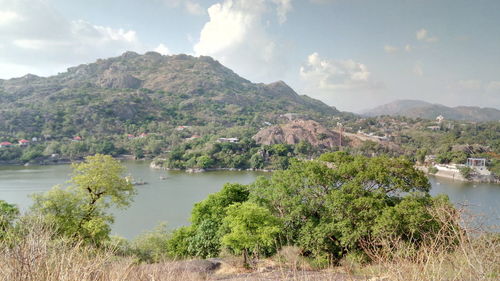 Scenic view of mountains and lake against sky