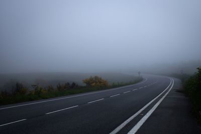 Empty road against clear sky