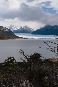 Scenic view of mountains against cloudy sky