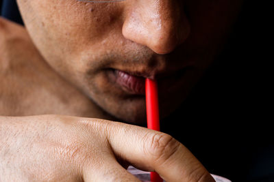 Close-up of someone drinking smoothie 