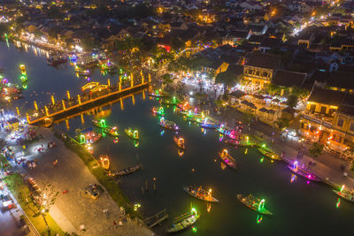 High angle view of illuminated buildings in city at night