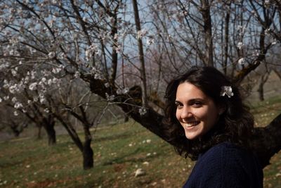 Portrait of a smiling young woman in park