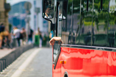 Close-up of red car on street