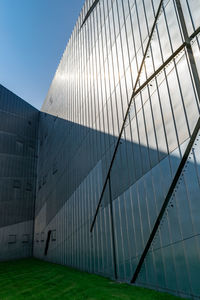 Low angle view of modern building against clear sky