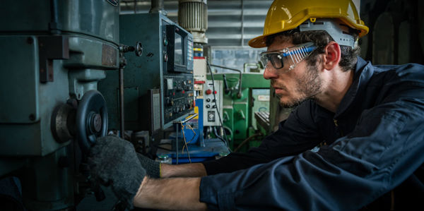 Male engineer working in an industrial factory. concept industry.