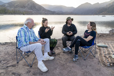 Family enjoying time together while relaxing outdoors in nature.