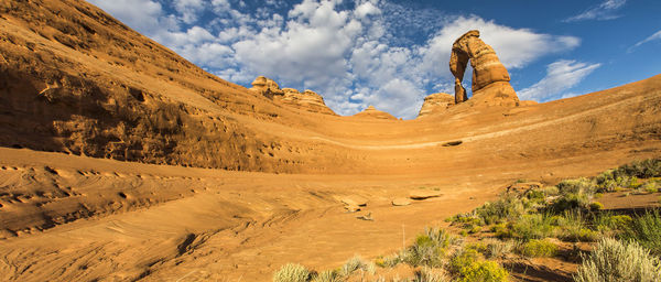 Panoramic view of arid landscape against sky