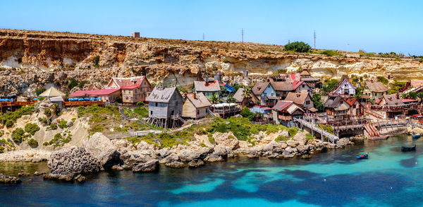 Popeye village, malta - july 19, 2019. aerial panorama of popeye village, sweethaven village, malta.