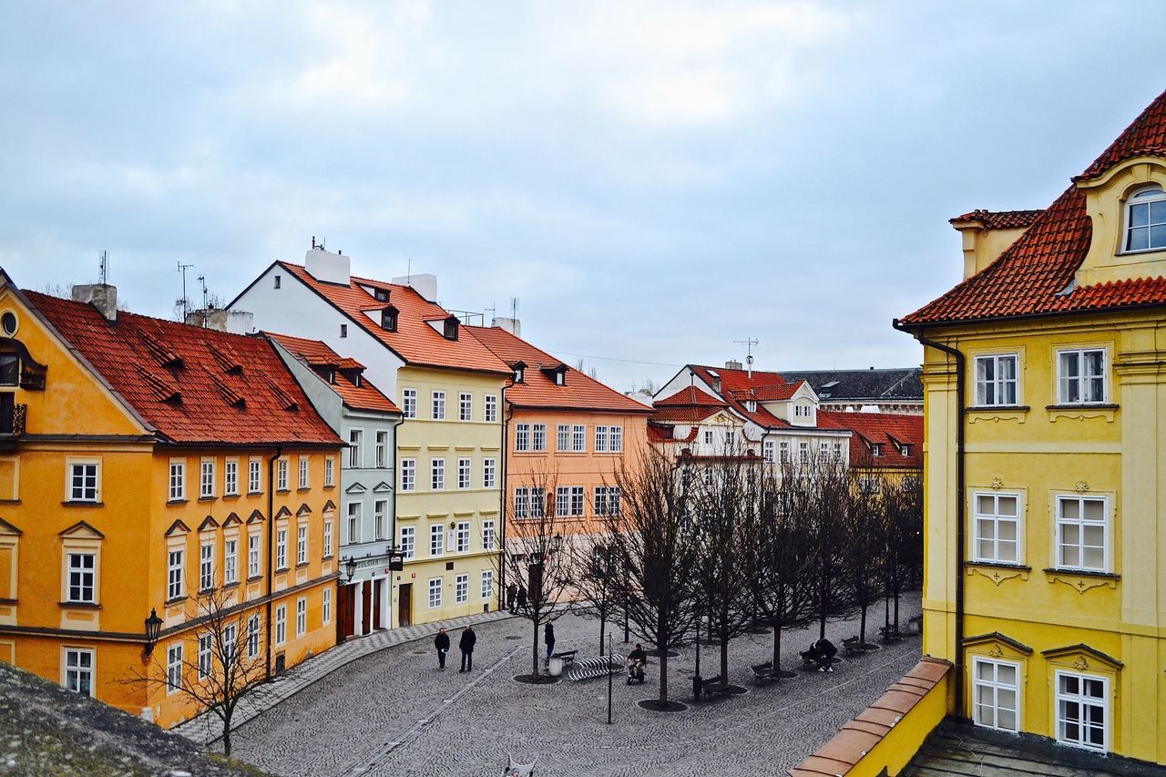 building exterior, architecture, built structure, residential structure, residential building, sky, street, house, city, residential district, town, cloud - sky, building, old town, city life, cloud, day, road, outdoors, incidental people