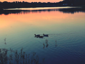 Scenic view of lake against sky during sunset