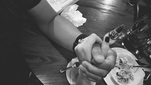 Cropped image of woman holding flower