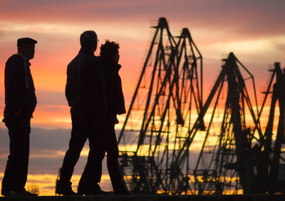 Silhouette of people at sunset