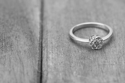 Close-up of wedding rings on table