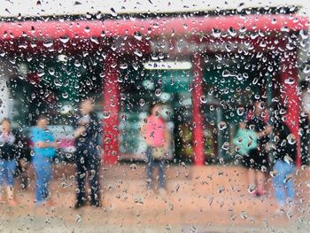 Full frame shot of wet glass window in rainy season