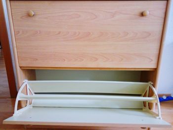 High angle view of empty chair on table at home