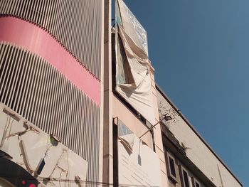 Low angle view of building against blue sky