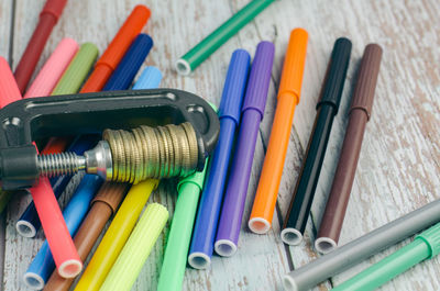 Close-up of multi colored pencils on table