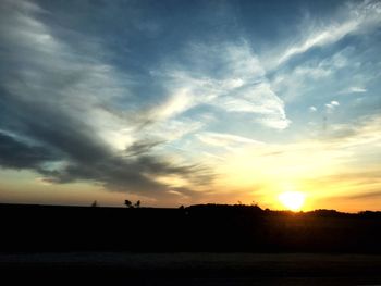 Scenic view of silhouette land against sky during sunset