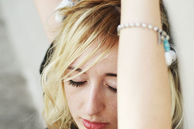 Close-up of young woman with blond hair