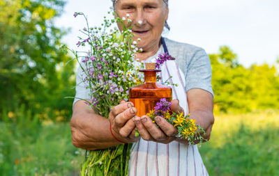 Portrait of woman holding flower