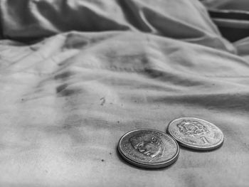 Close-up of coins on table