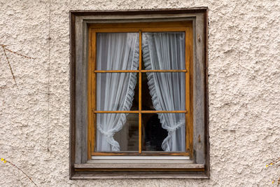 Low angle view of window on house wall