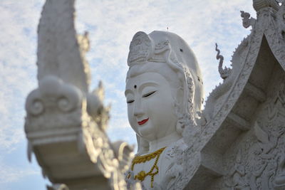 Low angle view of statue against building