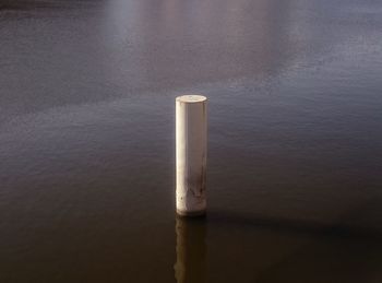 View of wooden post in the sea
