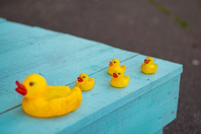 High angle view of yellow toys in a container