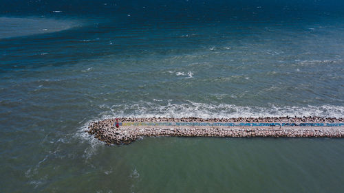 High angle view of deck chairs on beach