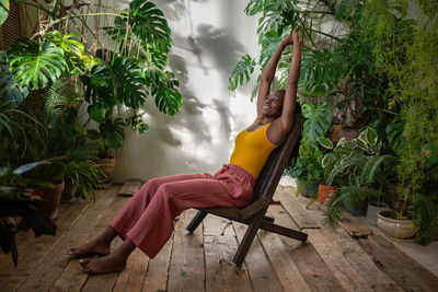 Young woman sitting on chair