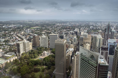 High angle view of cityscape by sea against sky