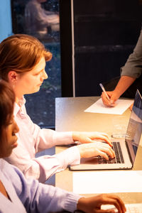 Young woman using laptop at home