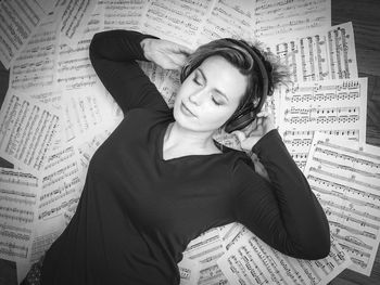 Portrait of young woman reading book