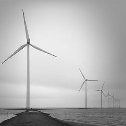 Traditional windmill against sky