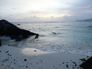 Scenic view of sea against sky at sunset