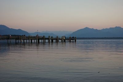 Scenic view of sea against clear sky at sunset