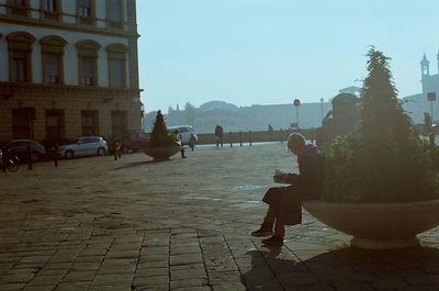 Woman standing in city