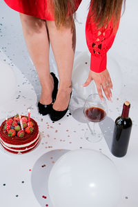 High angle view of woman standing on table