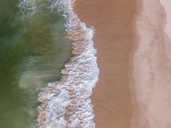 Close-up of waves rushing towards shore