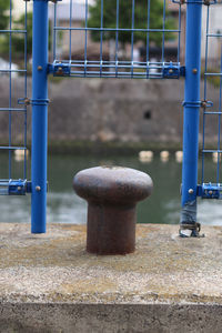 Close-up of metal railing in park