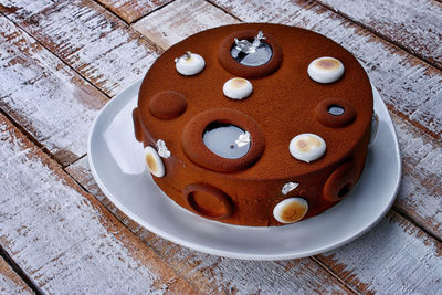 High angle view of chocolate cake in plate on table