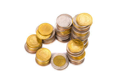 Stack of coin against white background