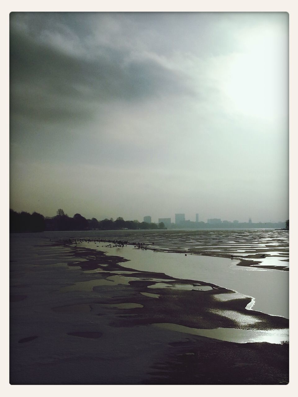 SCENIC VIEW OF SEA BY CITY AGAINST SKY